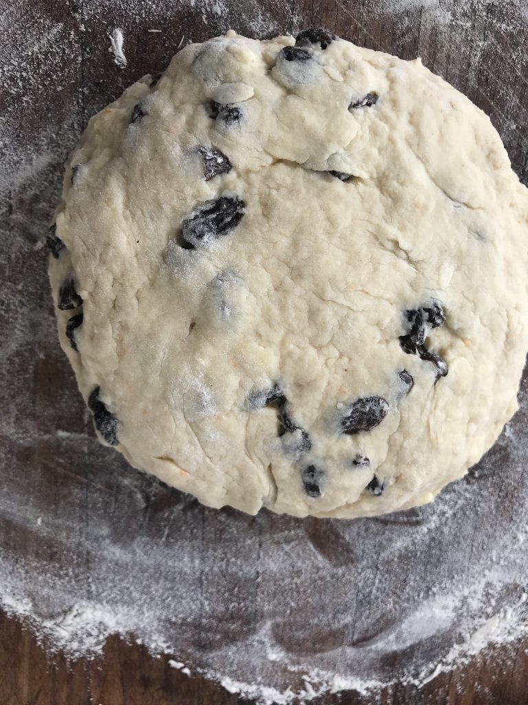  dough in a ball on a lightly floured cutting board