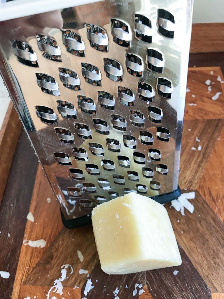 Box grater and Parmesan cheese