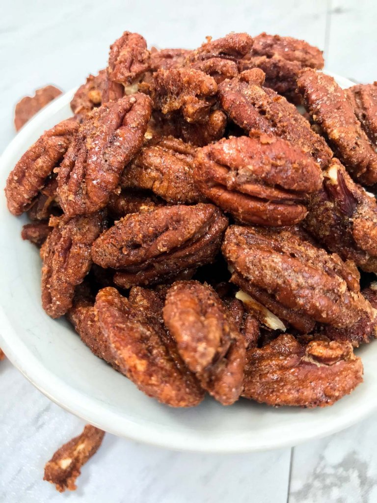 Close up of spiced pecans in serving bowl