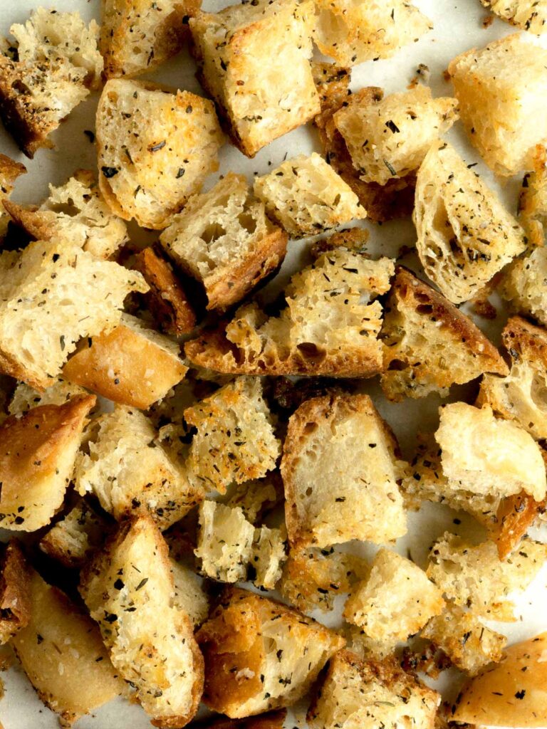 Croutons on a parchment lined sheet pan
