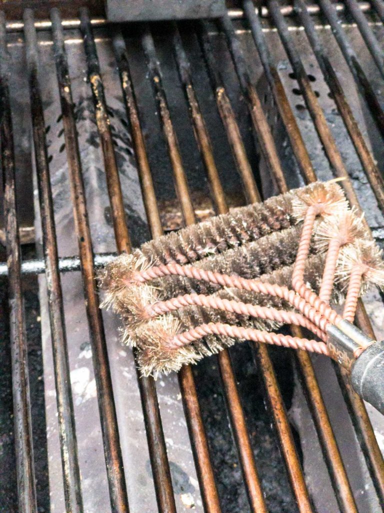 Grill grate brush cleaning grates on grill