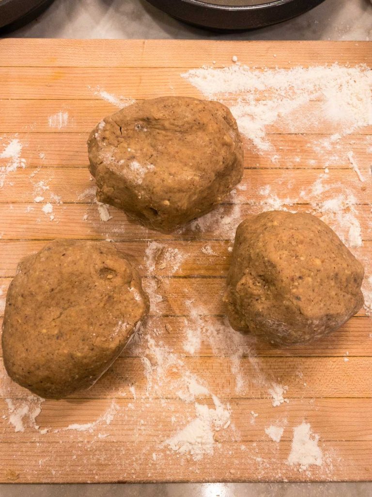 Three balls of dough on cutting board